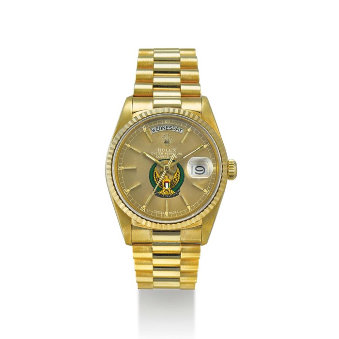 ROLEX. AN 18K GOLD AUTOMATIC WRISTWATCH WITH SWEEP CENTRE SECONDS, DAY, DATE AND BRACELET, MADE FOR THE UNITED ARAB EMIRATES SIGNED ROLEX, OYSTER PERPETUAL, DAY-DATE MODEL, REF. 18038, CASE NO. 9’822’993, CIRCA 1987