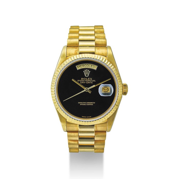 ROLEX. AN 18K GOLD AUTOMATIC WRISTWATCH WITH SWEEP CENTRE SECONDS, DAY, DATE, BRACELET AND ONYX DIAL SIGNED ROLEX, OYSTER PERPETUAL, DAY-DATE MODEL, REF. 18038, CASE NO. 8’405’820, CIRCA 1984