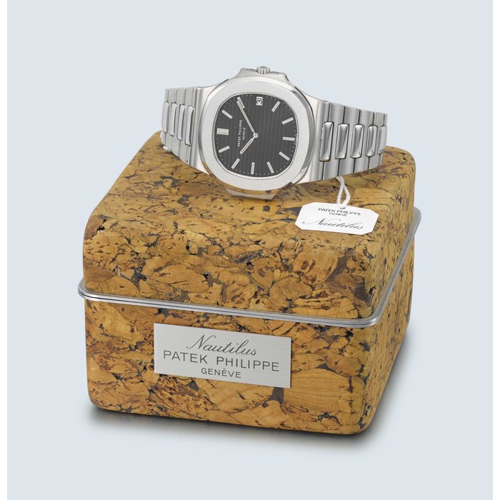 PATEK PHILIPPE. A VERY RARE AND FINE STAINLESS STEEL AUTOMATIC WRISTWATCH WITH DATE, BRACELET AND ORIGINAL NAUTILUS CORK BOX SIGNED PATEK PHILIPPE, GENEVE, NAUTILUS MODEL, REF. 3700/11, MOVEMENT NO. 1'310'061, CASE NO. 539'236, MANUFACTURED IN 1981