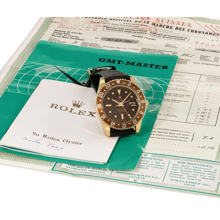 Rolex. A fine and rare 18K gold automatic dual time wristwatch with sweep centre seconds, date, transitional case without crown guards, Watch Rate Certificate duplicate and Guarantee for a serial number close to the present one , box and seal SIGNED ROLEX, OYSTER PERPETUAL, GMT-MASTER, SUPERLATIVE CHRONOMETER OFFICIALLY CERTIFIED, REF. 1675, CASE NO. 1'480'908, MANUFACTURED IN 1967