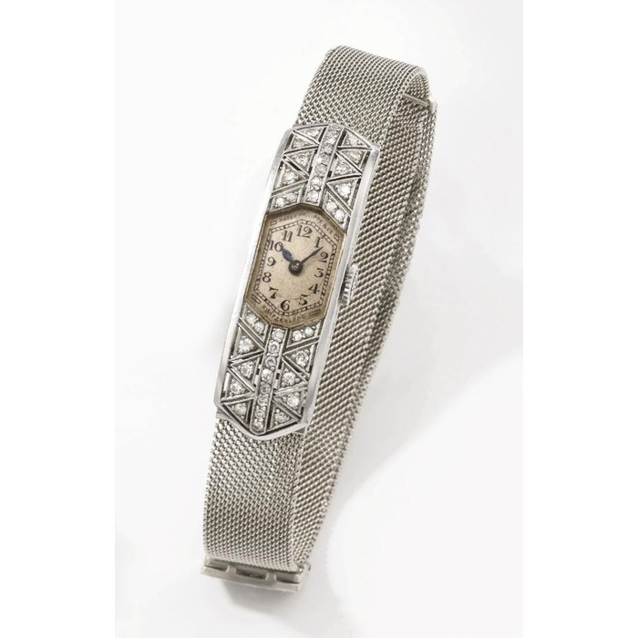 Patek Philippe. A lady's very fine, rare and attractive platinum and diamond-set rectangular curved Art Deco wristwatch with Gay Frères bracelet SIGNED PATEK PHILIPPE & CO., GENÈVE, MOVEMENT NO. 811'818, CASE NO. 604'194, MANUFACTURED IN 1925