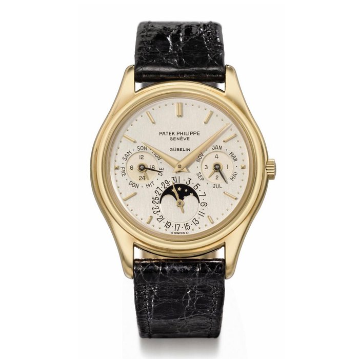 Patek Philippe. A fine 18K gold automatic perpetual calendar wristwatch with moon phases, original certificate and box SIGNED PATEK PHILIPPE, GENÈVE, RETAILED BY GÜBELIN, REF. 3940, MOVEMENT NO. 770'155, CASE NO. 2'824'923, MANUFACTURED IN 1986