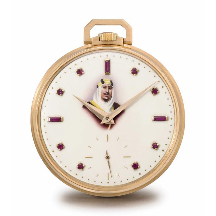 Patek Philippe. A very fine and rare 18K pink gold openface keyless lever watch with ruby-set enamel dial with the portrait of King Abdul Aziz Al Saud of Saudi Arabia SIGNED PATEK PHILIPPE & CO., GENÈVE, REF. 600/1, MOVEMENT NO. 931'433, CASE NO. 694'693, MANUFACTURED IN 1956