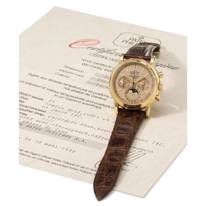 Patek Philippe. A very fine, rare and attractive 18K gold perpetual calendar chronograph wristwatch with phases of the moon, champagne dial and original certificate SIGNED PATEK PHILIPPE, GENÈVE, REF. 3970, MOVEMENT NO. 875'493, CASE NO. 2'860'479, MANUFACTURED IN 1989