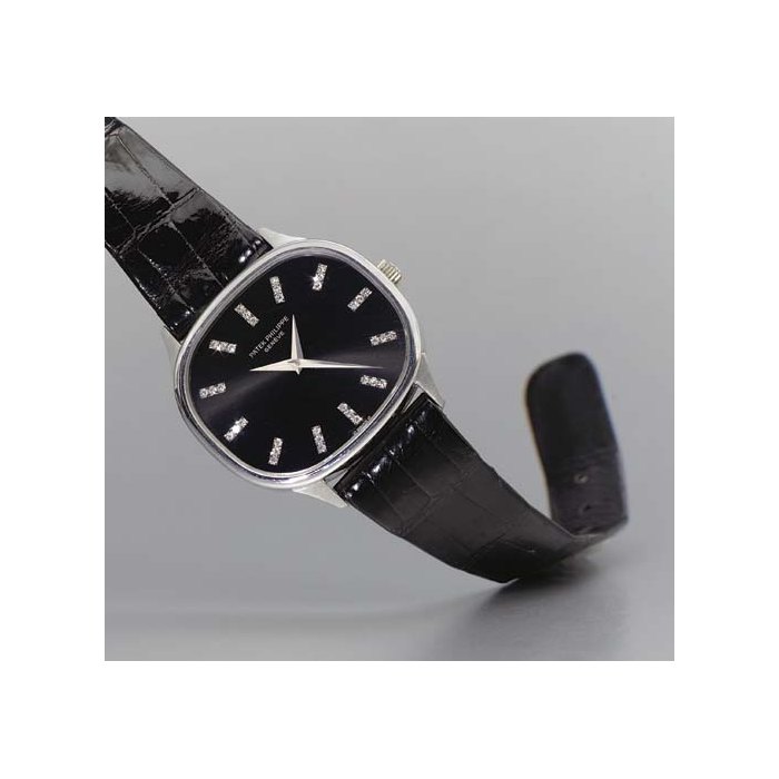 Patek Philippe. A fine and rare 18K white gold and diamond-set cushion-shaped dual time zone wristwatch with black dial SIGNED PATEK PHILIPPE, GENEVE, MOVEMENT NO. 739749, CASE NO. 2757178, REF. 3619, CIRCA 1962