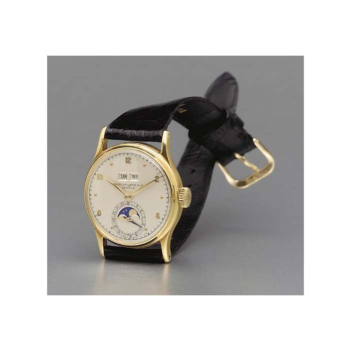 Patek Philippe. A fine and rare 18K gold perpetual calendar wristwatch with phases of the moon SIGNED PATEK PHILIPPE & CO., GENEVE, MOVEMENT NO. 928699, CASE NO. 646255, REF. 1526, CIRCA 1946