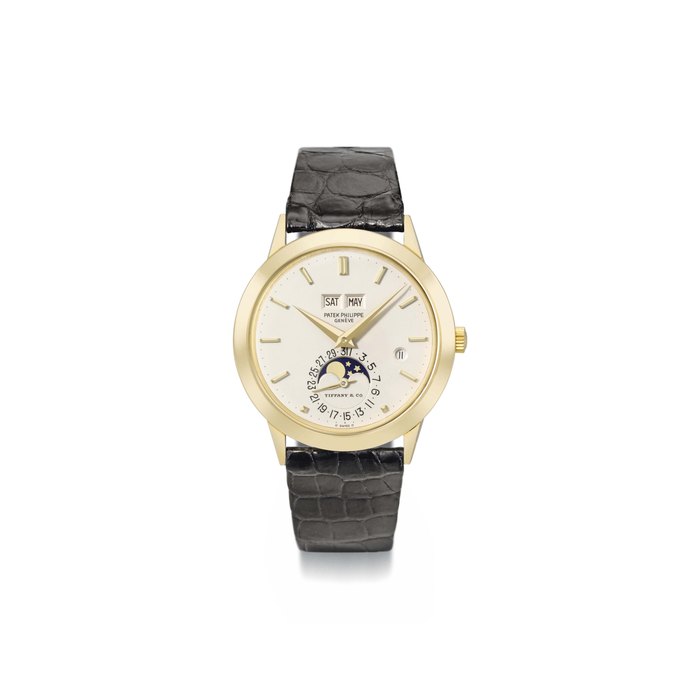 Patek Philippe. A fine and rare 18K gold automatic perpetual calendar wristwatch with moon phases, Roman leap year indicator and bracelet SIGNED PATEK PHILIPPE, GENÈVE, RETAILED BY TIFFANY & CO., REF. 3450, MOVEMENT NO. 1'119'666, CASE NO. 558'589, MANUFACTURED IN 1983