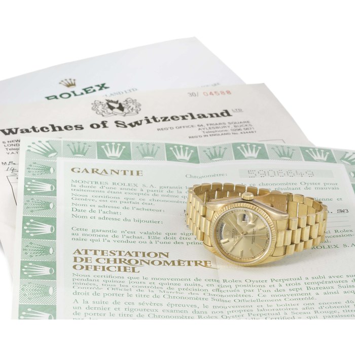 Rolex. An 18K gold automatic wristwatch with sweep centre seconds, day, date and bracelet SIGNED ROLEX, OYSTER PERPETUAL, DAY-DATE, REF. 18038, CASE NO. 6'269'127, MANUFACTURED IN 1980