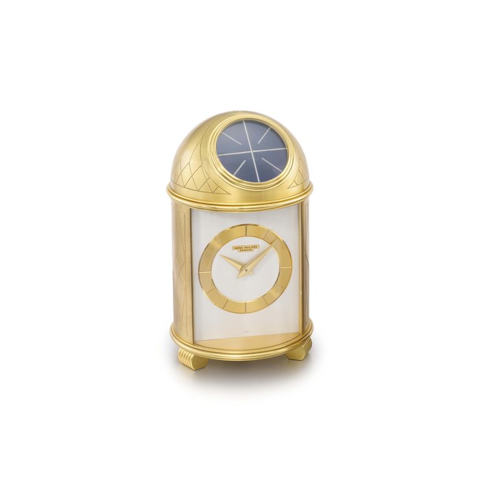 Patek Philippe. A fine and very rare gilt brass solar-powered dome table clock with original box SIGNED PATEK PHILIPPE, GENÈVE, REF. 710, DOME MODEL, MOVEMENT NO. 872'688, CASE NO. 192, MANUFACTURED IN 1957