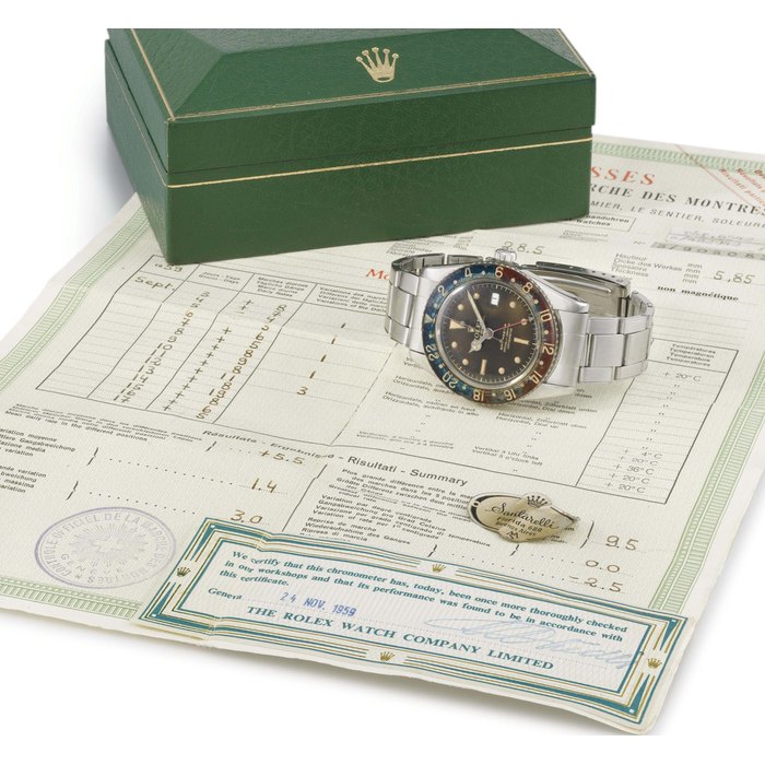 Rolex. A rare stainless steel automatic dual time wristwatch with sweep centre seconds, date, bracelet, bakelite bezel, brown-coloured dial, original bulletin de marche and box SIGNED ROLEX, OYSTER PERPETUAL, GMT-MASTER, REF. 6542, CASE NO. 428'942, MANUFACTURED IN 1959