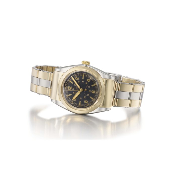 Rolex. A fine, rare and very attractive stainless steel and 14K gold automatic bubble-back wristwatch with black 24 hours dial, sweep centre seconds, hooded lugs and bracelet SIGNED ROLEX, OYSTER PERPETUAL, SELF WINDING, REF. 3065, CASE NO. 303'239, MANUFACTURED IN 1945
