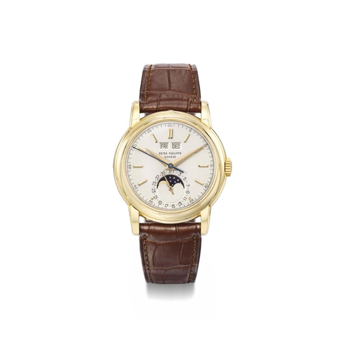 Patek Philippe. A very fine and rare 18K gold perpetual calendar wristwatch with sweep centre seconds, moon phases and screw back SIGNED PATEK PHILIPPE, GENÈVE, REF. 2438/1, MOVEMENT NO. 888'148, CASE NO. 2'602'748, MANUFACTURED IN 1958