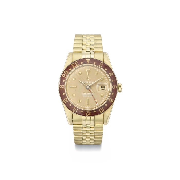 Rolex. A very rare and highly attractive 18K gold automatic dual time wristwatch with bronze-coloured dial, sweep centre seconds, date, bakelite bezel, bracelet and box SIGNED ROLEX, OYSTER-PERPETUAL, GMT-MASTER, RETAILED BY SERPICO Y LAINO, REF. 6542, CASE NO. 367'395, MANUFACTURED IN 1958