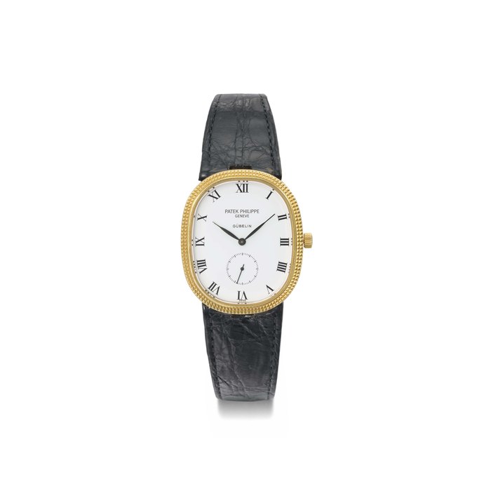 Patek Philippe. A 18K gold oval wristwatch SIGNED PATEK PHILIPPE, GENÈVE, RETAILED BY GÜBELIN, GOLDEN ELLIPSE MODEL, REF. 3987, MOVEMENT NO. 1'356'585, CASE NO. 2'833'240, MANUFACTURED IN 1986