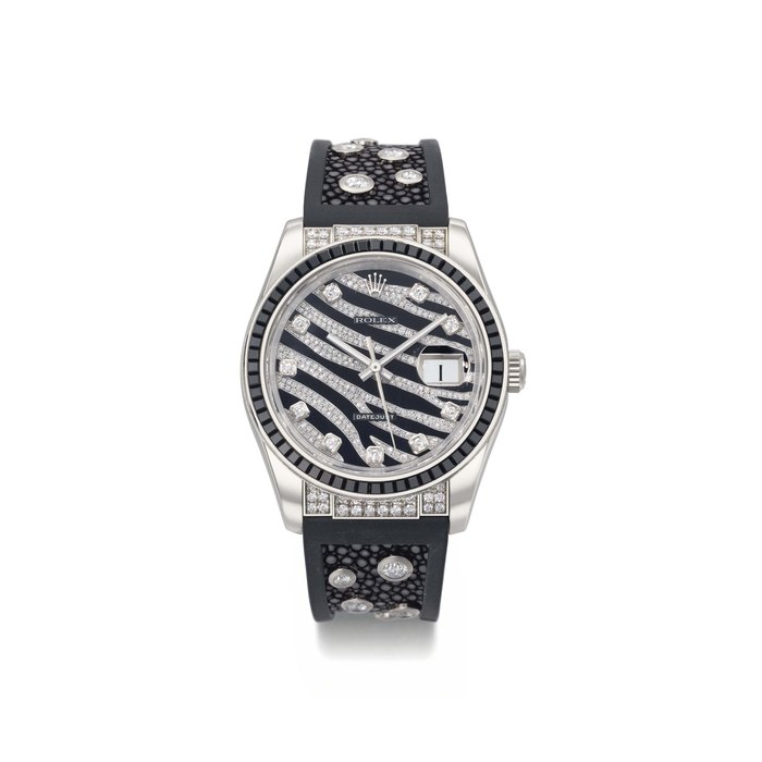 Rolex. An 18K white gold, black sapphire and diamond set automatic wristwatch with sweep centre seconds and date SIGNED ROLEX, DATEJUST, REF. 116199 SANR, CASE NO. M297755, MANUFACTURED IN 2008