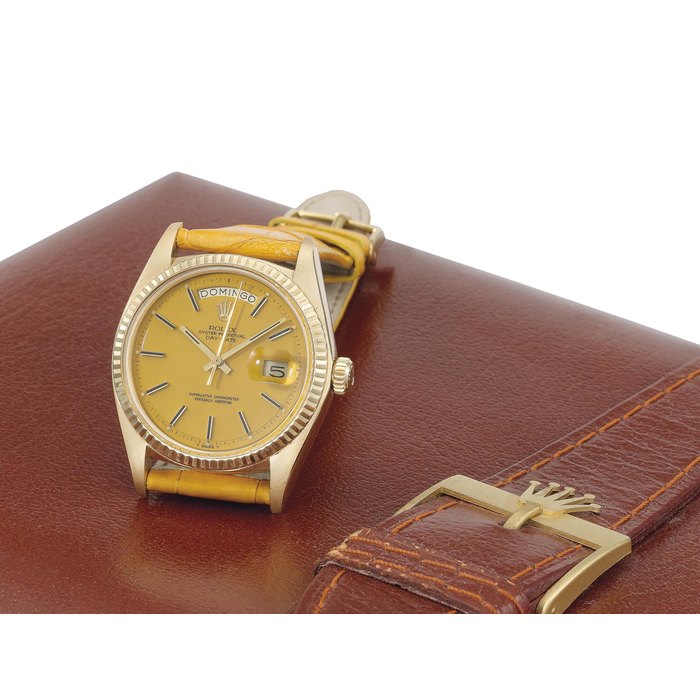 Rolex. An attractive 18K gold automatic calendar wristwatch with sweep centre seconds and yellow lacquered dial SIGNED ROLEX, OYSTER PERPETUAL, DAY-DATE, REF. 1803, CASE NO. 5'031'760, MANUFACTURED IN 1976
