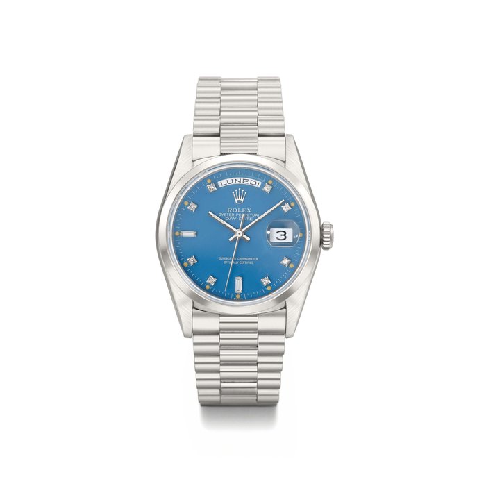 Rolex. An attractive platinum and diamond-set automatic calendar wristwatch with sweep centre seconds, turquoise dial and original Guarantee SIGNED ROLEX, OYSTER-PERPETUAL, DAY-DATE, REF. 18206, CASE NO. L778033, MANUFACTURED IN 1990