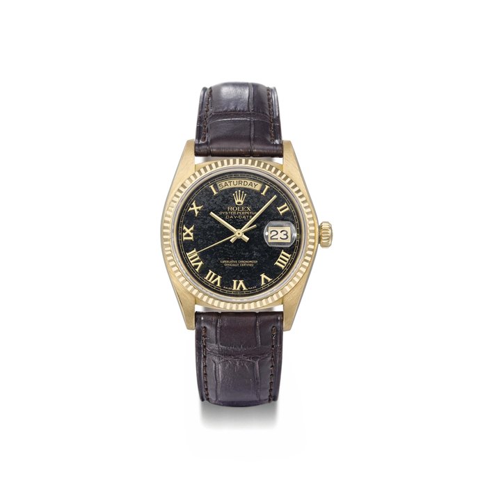 Rolex. An attractive 18K gold automatic calendar wristwatch with sweep centre seconds and black hard-stone dial SIGNED ROLEX, OYSTER PERPETUAL, DAY-DATE, REF. 18038, CASE NO. 6'193'428, MANUFACTURED IN 1980