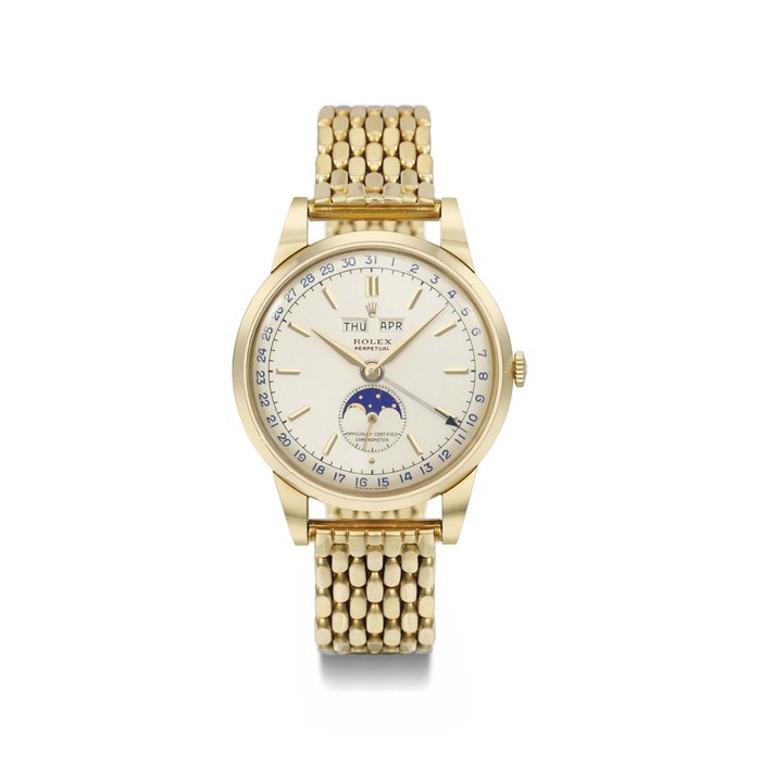 Rolex. An extremely fine and attractive 18K gold automatic triple calendar wristwatch with moonphase, two-tone silvered dial and bracelet SIGNED ROLEX, PERPETUAL, OFFICIALLY CERTIFIED CHRONOMETER, REF. 8171, NO. 042, MOVEMENT NOS. 10481 AND G4844, CASE NO. 791'039, CIRCA 1962