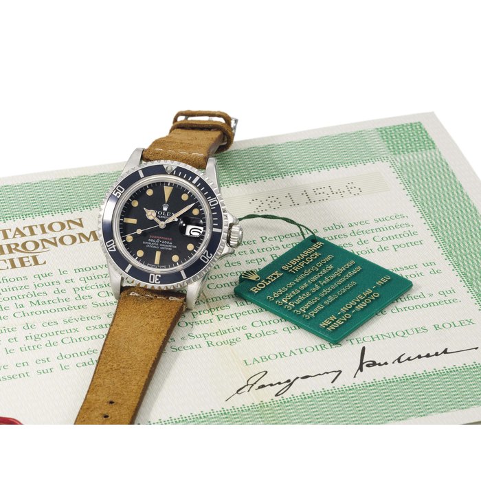 Rolex. A rare stainless steel automatic wristwatch with sweep centre seconds, date, Guarantee and box SIGNED ROLEX, OYSTER PERPETUAL DATE, SUBMARINER, 660FT=200M, REF. 1680, CASE NO. 2'811'546, CIRCA 1971