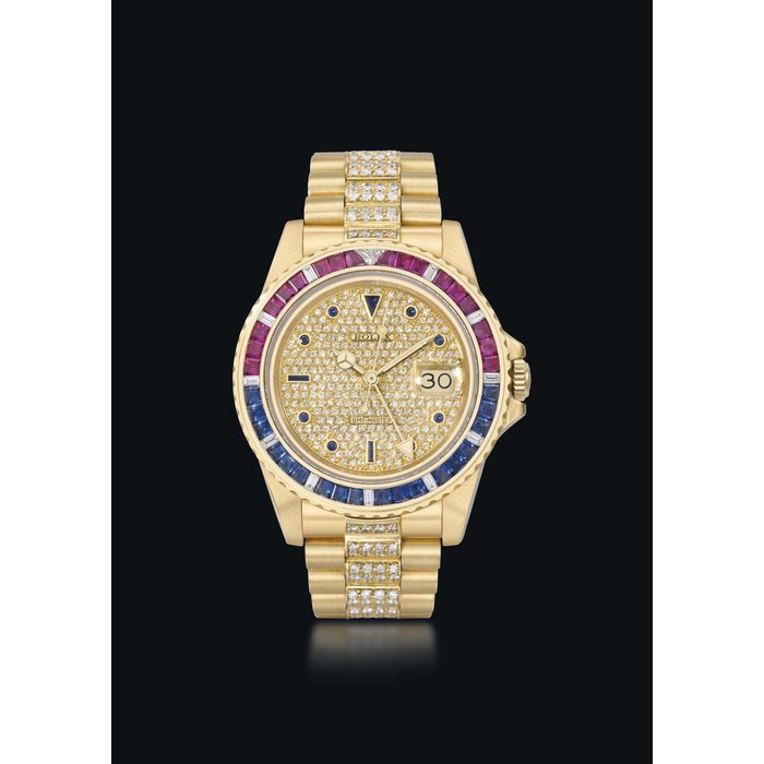 Rolex Rolex. An extremely rare and attractive 18K gold, diamond, ruby and sapphire-set automatic dual time wristwatch with sweep centre seconds, date and bracelet SIGNED ROLEX, GMT-MASTER, SARU MODEL, REF. 16758, CASE NO. 8'780'250, MANUFACTURED IN 1984 · 16758