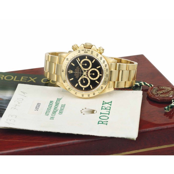Rolex Rolex. An attractive and early 18K gold chronograph wristwatch with bracelet, Guarantee and box SIGNED ROLEX, OYSTER PERPETUAL, SUPERLATIVE CHRONOMETER OFFICIALLY CERTIFIED, COSMOGRAPH, DAYTONA, REF. 16528, CASE NO. R985203, CIRCA 1988 · 16528