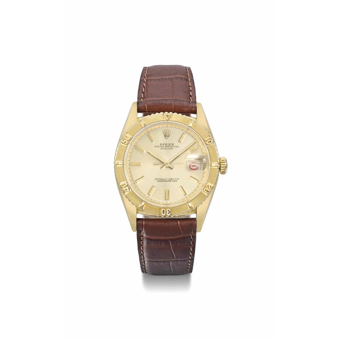 Rolex. An 18K gold automatic wristwatch with sweep centre seconds, alternate red and black date, "Thunderbird" bezel and champagne dial SIGNED ROLEX, OYSTER PERPETUAL, DATEJUST, REF. 6309, CASE NO. 85'624, CIRCA 1958