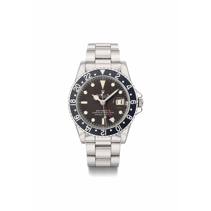 Rolex. A rare stainless steel automatic dual time wristwatch with sweep centre seconds, date, bracelet and brown-color change dial SIGNED ROLEX, OYSTER PERPETUAL, GMT-MASTER, SUPERLATIVE CHRONOMETER OFFICIALLY CERTIFIED, REF. 1675, CASE NO. 1'826'601, CIRCA 1968