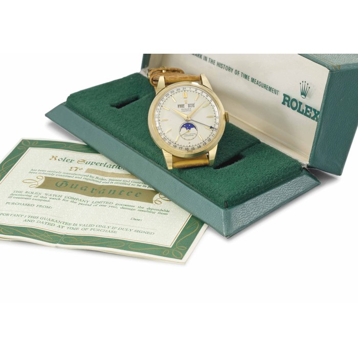 Rolex. An extremely fine, rare and attractive 18K gold automatic triple calendar wristwatch with moon phase, two-tone silvered dial and box SIGNED ROLEX, PERPETUAL, OFFICIALLY CERTIFIED CHRONOMETER, REF. 8171, NO. 619, MOVEMENT NOS. G12045 AND 10399, CASE NO. 820'622, CIRCA 1952