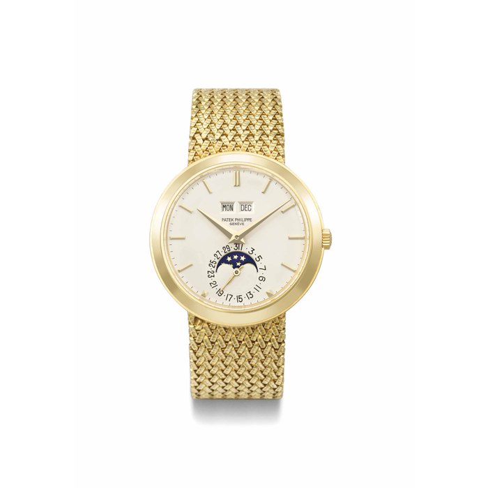Patek Philippe. A very fine and rare 18K gold automatic perpetual calendar wristwatch with moon phases, bracelet and box SIGNED PATEK PHILIPPE, GENEVE, REF. 3448/15, MOVEMENT NO. 1'119'469, CASE NO. 332'585, MANUFACTURED IN 1977