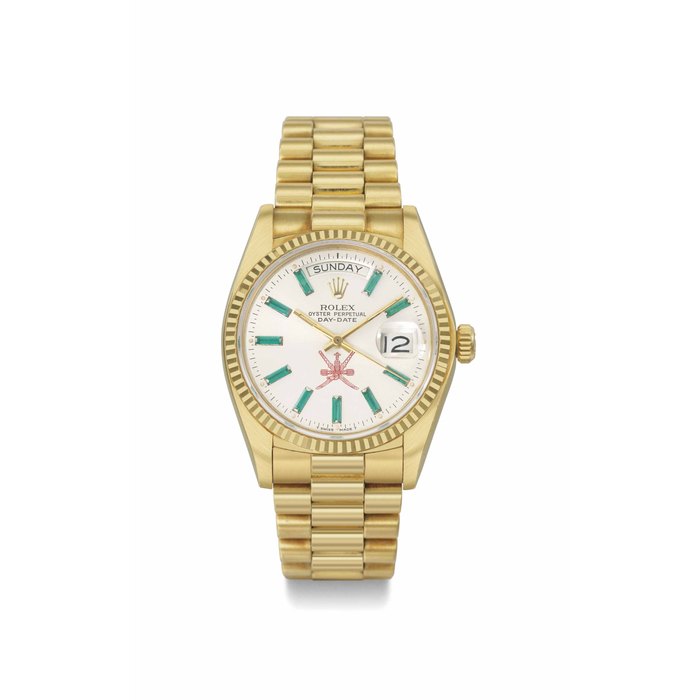Rolex. A rare and very attractive 18k gold and emerald-set automatic wristwatch with day, date, and bracelet, made for the Sultanat of Oman SIGNED ROLEX, OYSTER PERPETUAL, DAY-DATE, REF. 18038, CASE NO. 5'803'670, MANUFACTURED IN 1979