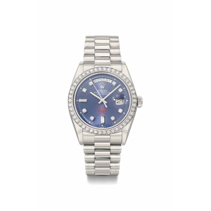 Rolex. A fine and very rare platinum and diamond-set automatic wristwatch with day, date, and bracelet, made for the Sultanat of Oman SIGNED ROLEX, OYSTER PERPETUAL, DAY-DATE, RETAILED BY ASPREY, REF. 1804, CASE NO. 3'711'028, MANUFACTURED IN 1974