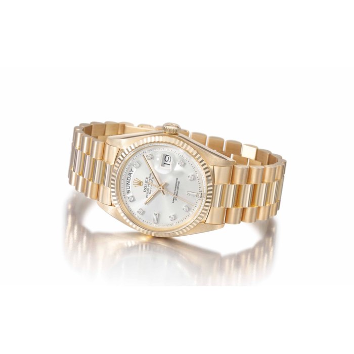Rolex. A rare and impressive 18k pink gold and diamond automatic wristwatch with sweep centre seconds, day, date and bracelet SIGNED ROLEX, OYSTER PERPETUAL, DAY-DATE, REF. 1803, CASE NO. 3'639'534, MANUFACTURED IN 1974