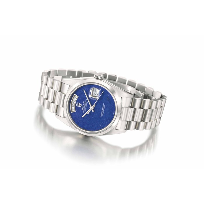 Rolex. An attractive and rare platinum automatic wristwatch with sweep centre seconds, day, date, lapis lazuli dial, bracelet and guarantee SIGNED ROLEX, OYSTER-PERPETUAL, DAY-DATE, REF. 18206, CASE NO. E254'455, CIRCA 1991