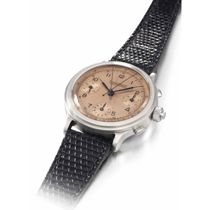 Eberhard. An extremely fine and unusual oversized stainless steel split seconds chronograph wristwatch with pink dial SIGNED EBERHARD & CO., LA CHAUX-DE-FONDS, MOVEMENT NO. 15'962, CASE NO. 26'013, CIRCA 1940