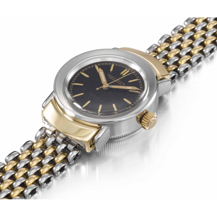 Rolex. A fine and rare stainless steel and gold automatic bubble back wristwatch with sweep centre seconds, black dial, hooded lugs and bracelet SIGNED ROLEX, OYSTER PERPETUAL, CHRONOMÈTRE, REF. 3536, CASE NO. 45'727, CIRCA 1940