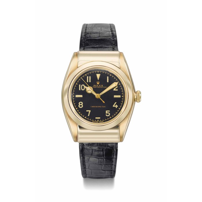 Rolex. A fine and rare 14K gold automatic wristwatch with sweep centre seconds and black gloss dial SIGNED ROLEX, OYSTER PERPETUAL, CHRONOMETER, REF. 3065, CASE NO. 494'360, CIRCA 1946