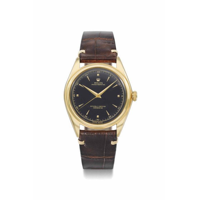 Rolex. A very rare and attractive 18K gold automatic wristwatch with sweep centre seconds and black lacquer dial SIGNED ROLEX, OYSTER PERPETUAL, REF. 5028, CASE NO. 675'089, CIRCA 1950