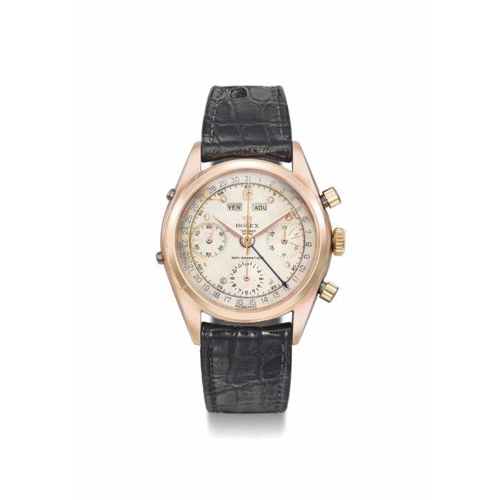 Rolex. A highly rare and attractive 18K pink gold triple calendar chronograph wristwatch with two-tone silvered dial SIGNED ROLEX, OYSTER CHRONOGRAPHE, ANTI-MAGNETIQUE, REF. 6036, CASE NO. 692'397, CIRCA 1961