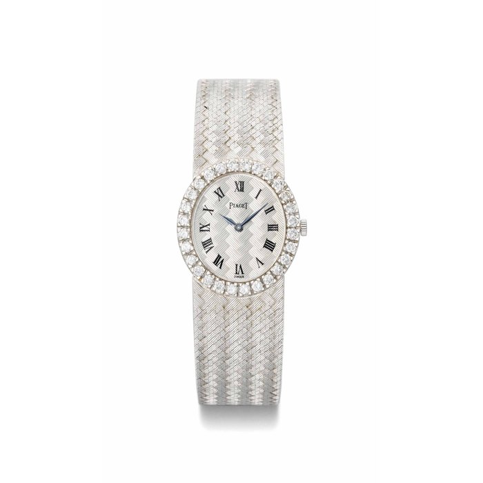 Piaget. A lady's fine 18K white gold and diamond-set bracelet watch SIGNED PIAGET, MOVEMENT NO. 690'423, CASE NOS. 9814B23 AND 150'568, MANUFACTURED IN 1968.