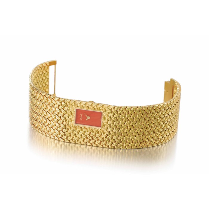 Piaget. A highly unusual and rare 18K gold bracelet watch with coral dial SIGNED PIAGET, CASE NOS. 3879D2 AND 327'473, MANUFACTURED IN 1978