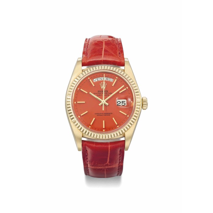 Rolex. An attractive 18K gold automatic calendar wristwatch with sweep centre seconds and red lacquered dial SIGNED ROLEX, OYSTER PERPETUAL, DAY-DATE, REF. 1803, CASE NO. 5'017'794, CIRCA 1977