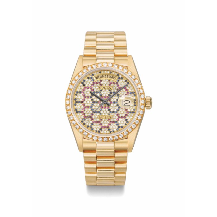 Rolex. A very rare and unusual 18K gold, diamond, ruby and sapphire-set automatic calendar wristwatch with sweep centre seconds and bracelet SIGNED ROLEX, DAY-DATE, REF. 18048, CASE NO. 9'178'540, CIRCA 1986