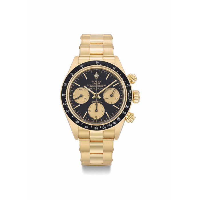 Rolex. A very fine and extremely rare 18K gold chronograph wristwatch with black dial and bracelet SIGNED ROLEX, OYSTER, COSMOGRAPH, RETAILED BY TIFFANY & CO., REF. 6263, CASE NO. 5'951'327, CIRCA 1979