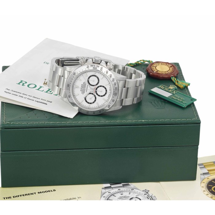 Rolex. A fine and very rare stainless steel automatic chronograph wristwatch with porcelain-style dial, bracelet, original Guarantee and box SIGNED ROLEX, OYSTER PERPETUAL, COSMOGRAPH, DAYTONA, REF. 16520, CASE NO. R782887, CIRCA 1989
