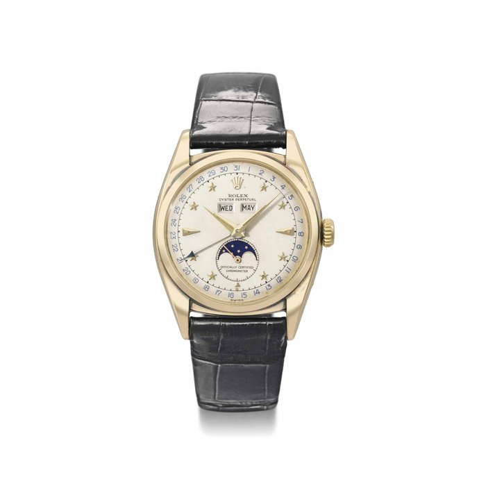 Rolex Rolex. A very rare, attractive and important 18K gold automatic triple calendar wristwatch with moon phases and star dial SIGNED ROLEX, OYSTER PERPETUAL, OFFICIALLY CERTIFIED CHRONOMETER, REF. 6062, CASE NO. 916'322, MANUFACTURED IN 1952 · 6062