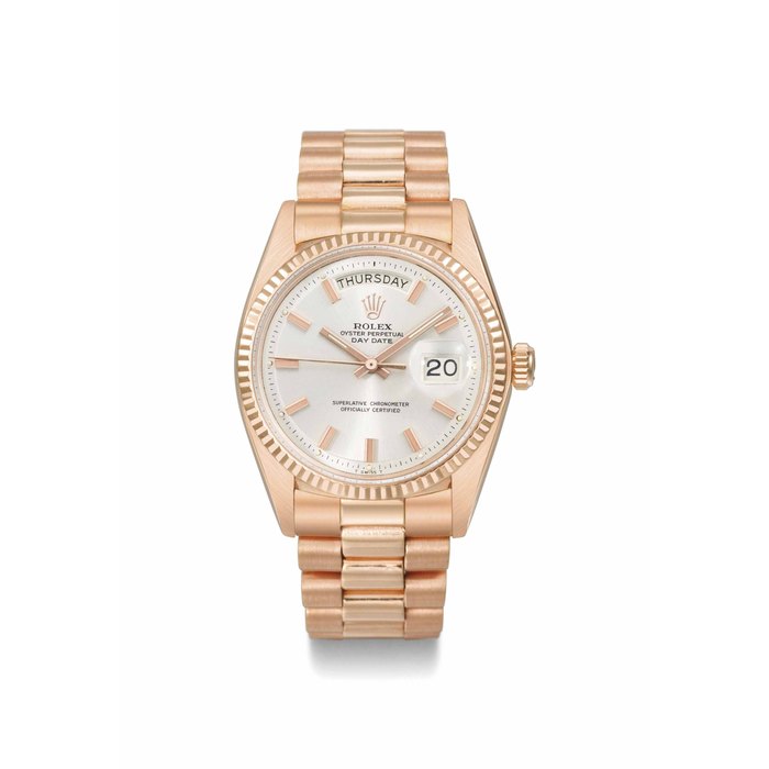 Rolex. A very rare 18K pink gold automatic calendar wristwatch with sweep centre seconds, bracelet and "ultra-flat" dial SIGNED ROLEX, OYSTER PERPETUAL, DAY-DATE, REF. 1803, CASE NO. 4'453'208, CIRCA 1972