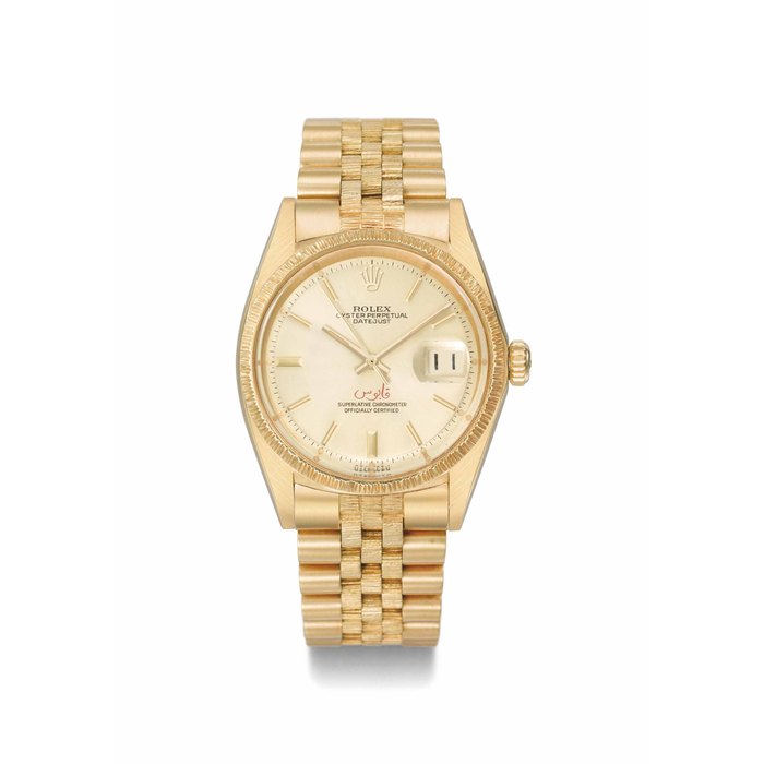Rolex. An attractive and rare 18K gold automatic wristwatch with date, bark-finish bezel and bracelet, made for the Sultanate of Oman SIGNED ROLEX, OYSTER PERPETUAL, DATEJUST, REF. 1607/1601, CASE NO. 2'909'296, CIRCA 1972