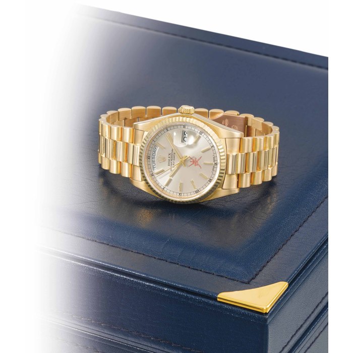 Rolex. A fine and attractive 18K gold automatic wristwatch with sweep centre seconds, day, date, bracelet and box, made for the Sultanate of Oman SIGNED ROLEX, OYSTER PERPETUAL, DAYDATE, REF. 18038, CASE NO. 5'954'614, CIRCA 1979