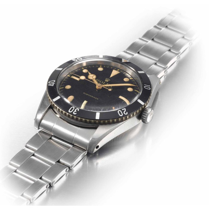 Rolex. A very fine and extremely rare stainless steel automatic wristwatch with sweep centre seconds and bracelet SIGNED ROLEX, OYSTER PERPETUAL, SUBMARINER, REF. 6205, MOVEMENT NO. 44715, CASE NO. 85851, MANUFACTURED IN 1954